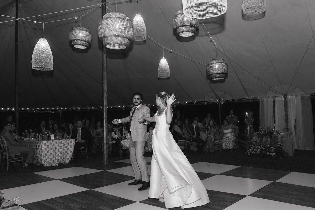 Couples first dance at a tented wedding at Wandby Landing in Kennebunk, Maine. 